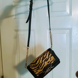 Clutch wristlet purse holds card holders on inside as well. It’s semi new!